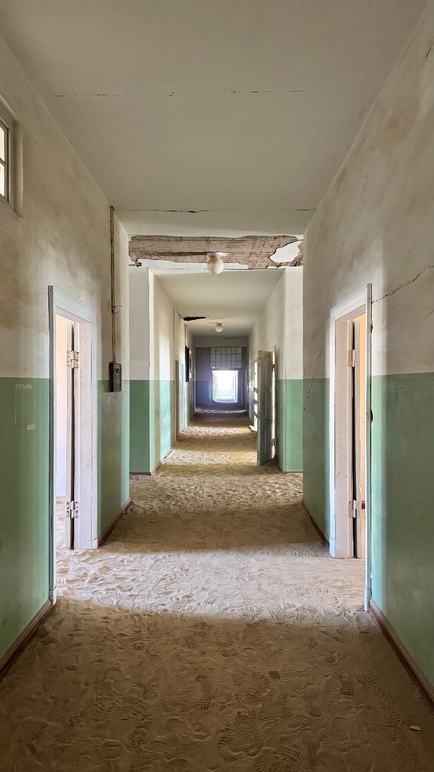 A sand-filled corridor in the Kolmanskop hospital